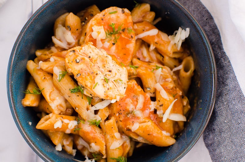 blue bowl of instant pot parmesan chicken and pasta