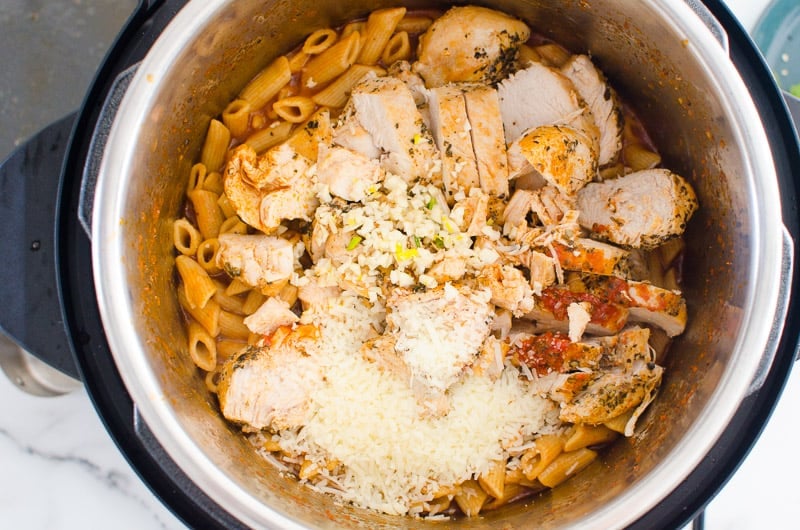 Instant Pot with chicken, pasta, cheese.