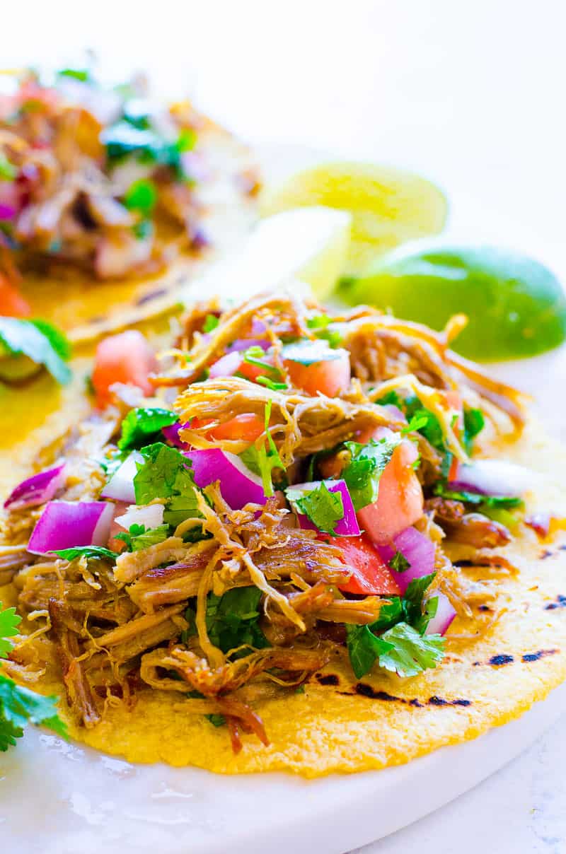 Instant Pot Carnitas served on a marble tray with lime