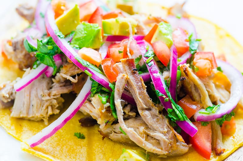 Instant Pot Carnitas served on a marble tray with lime