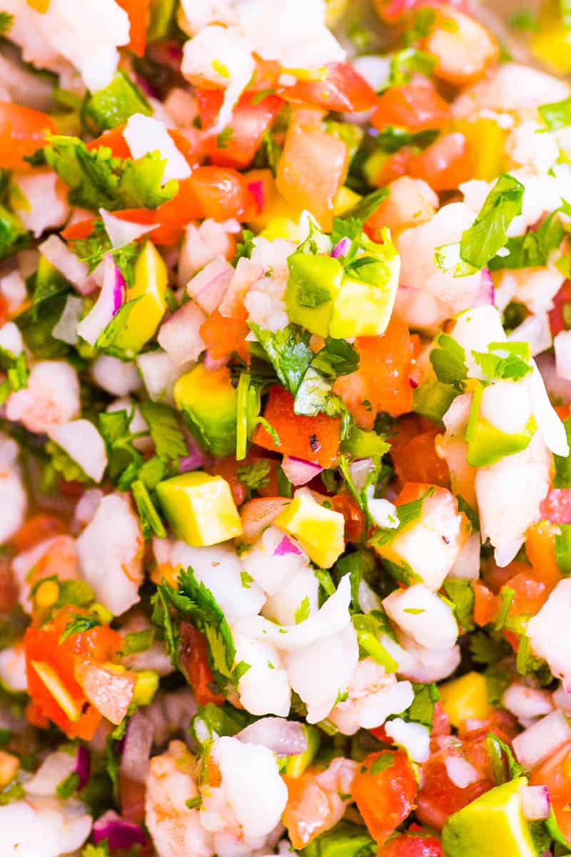 Closeup of shrimp ceviche recipe with cilantro, red onion and avocado.