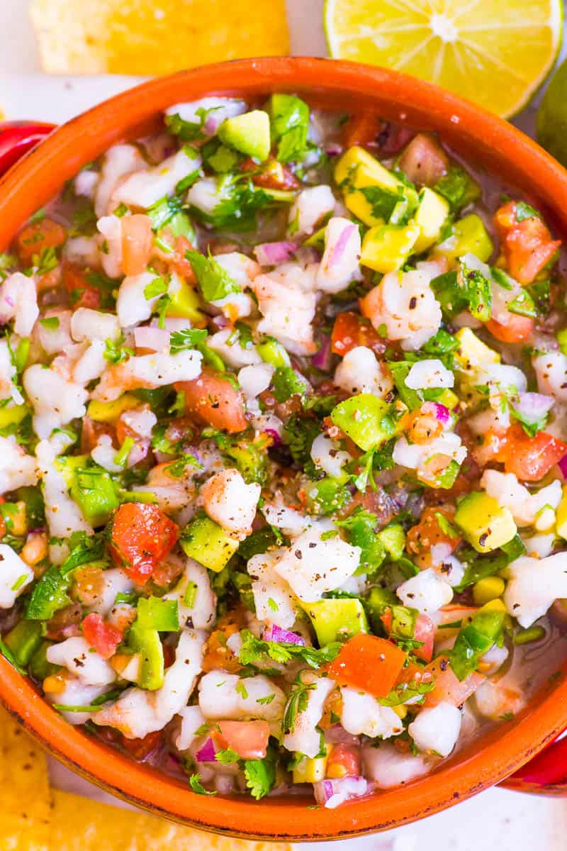 Mexican shrimp ceviche recipe in a bowl and chips on a side.