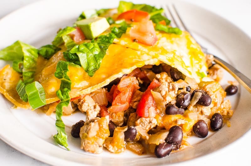 Taco skillet served on a plate with a fork.