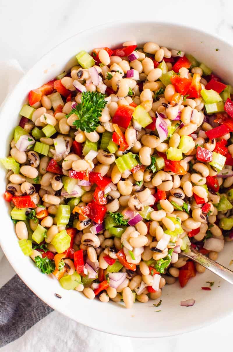 White bean salad in white bowl.