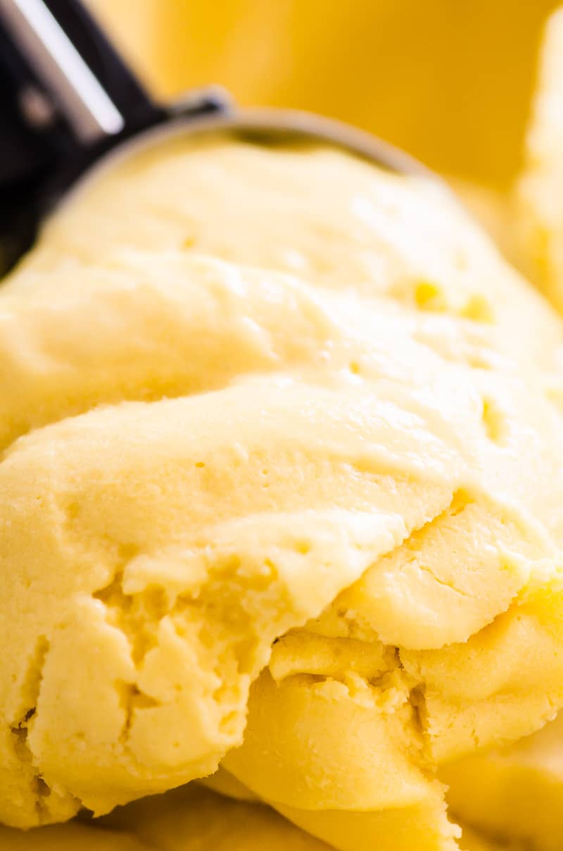 mango ice cream scooped closeup