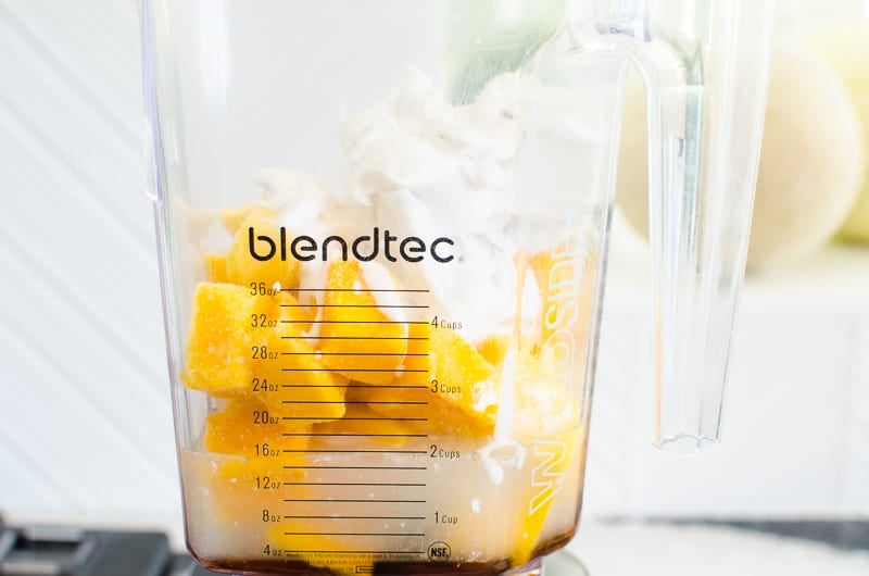 coconut mango dairy free ice cream being made in a blender