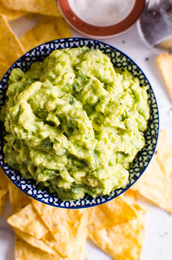 guacamole in dish with tortilla chips