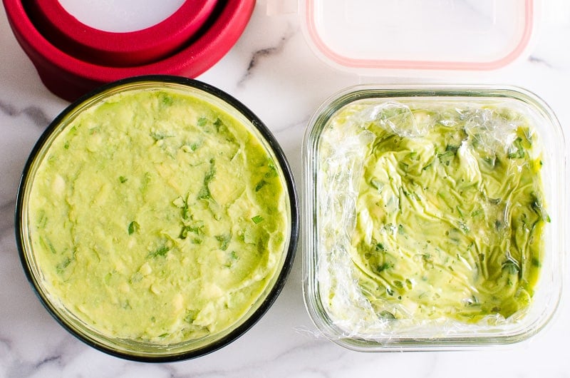 Guacamole stored in 2 containers with plastic wrap and cold water to prevent browning