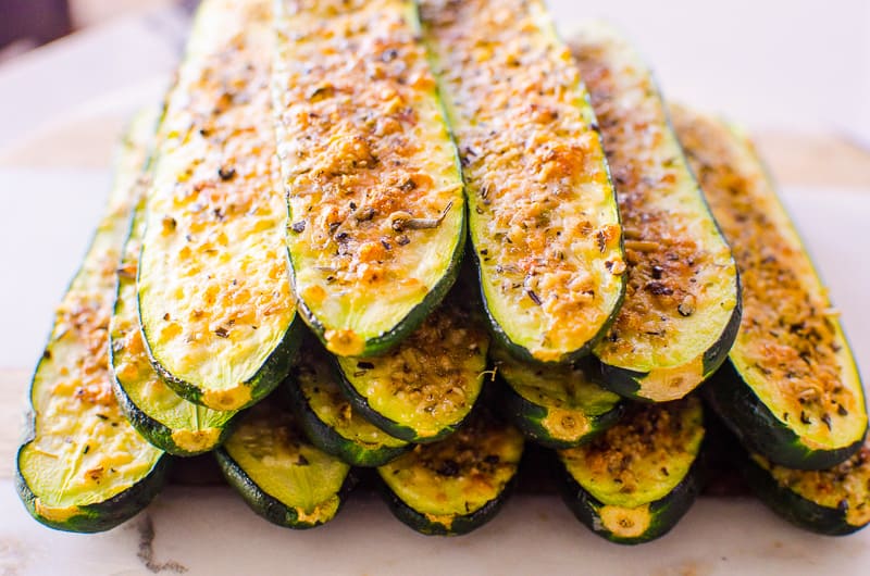 Parmesan zucchini sticks in a stack.