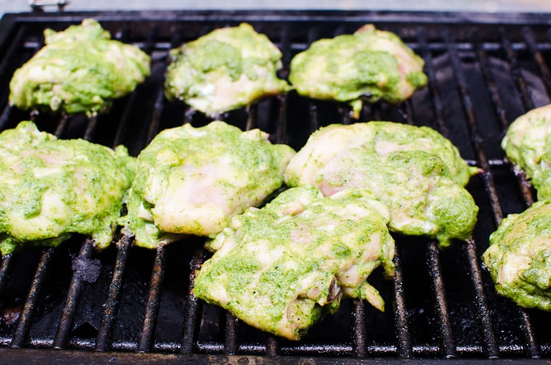 Grilling chicken thighs on the grill.