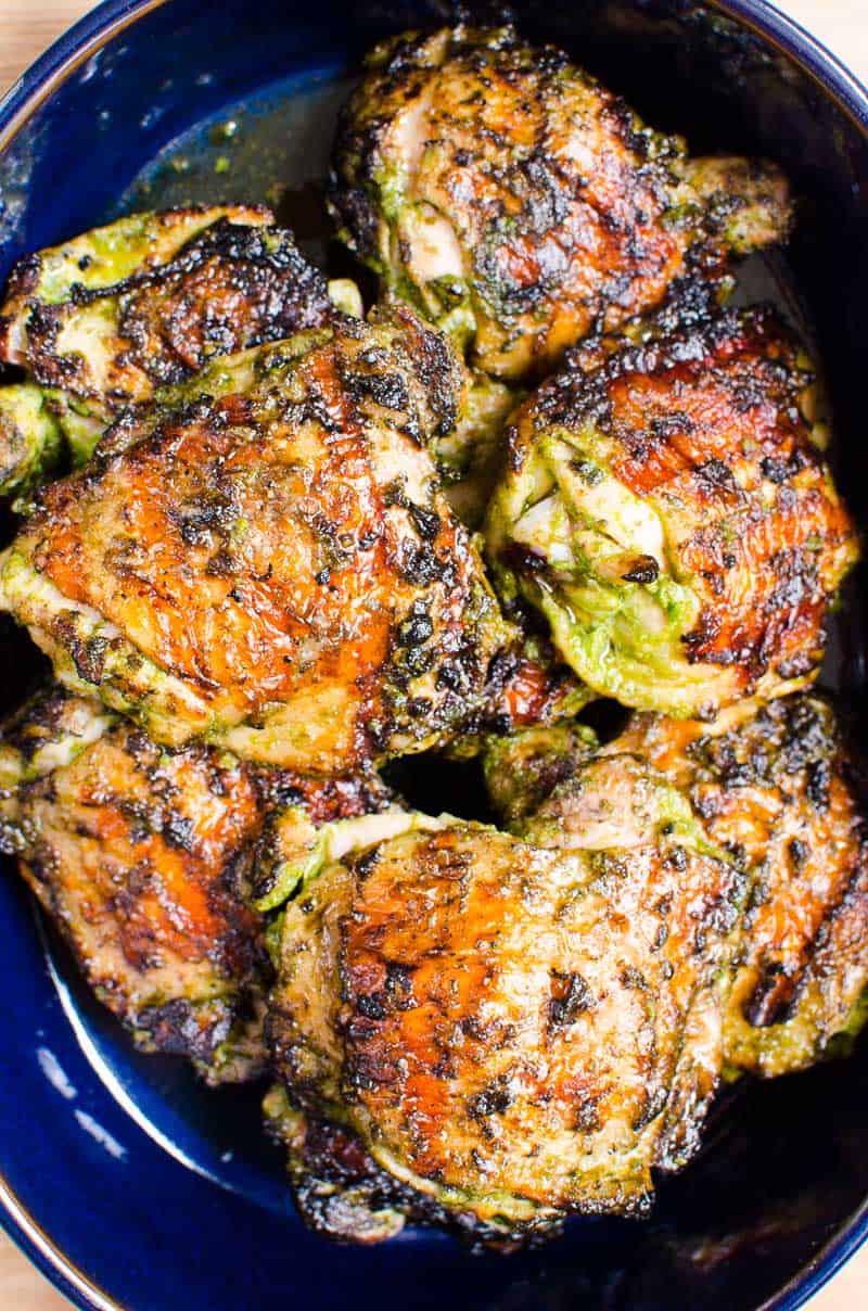 Grilled chicken thighs served in a baking dish.