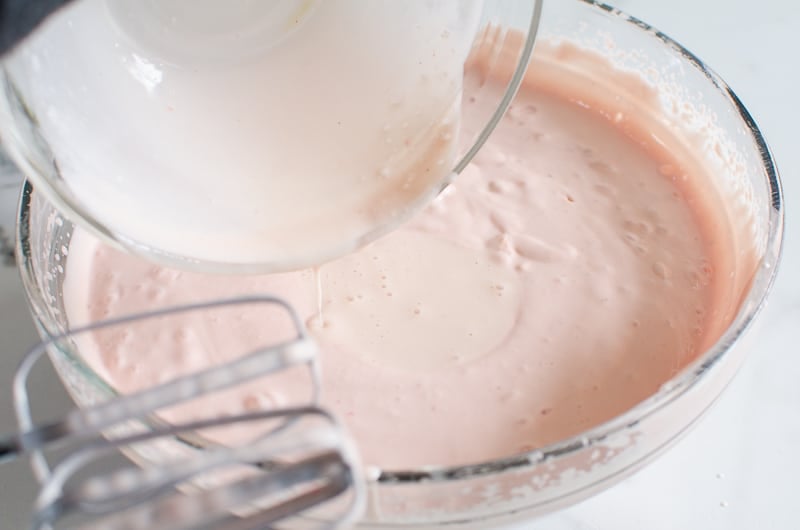Pour mixed gelatin and cheesecake mixture into bowl of strawberry cheesecake mix.