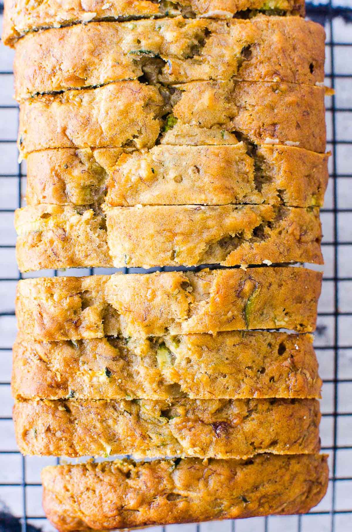 Sliced Zucchini Banana Bread on a cooling rack