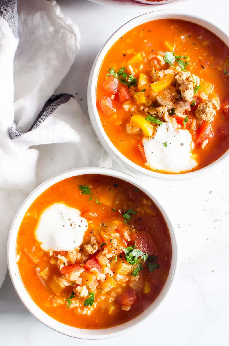 Instant Pot Stuffed Pepper Soup in two white bowls and napkin nearby