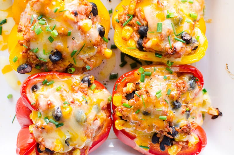 Mexican Stuffed Peppers garnished with green onion