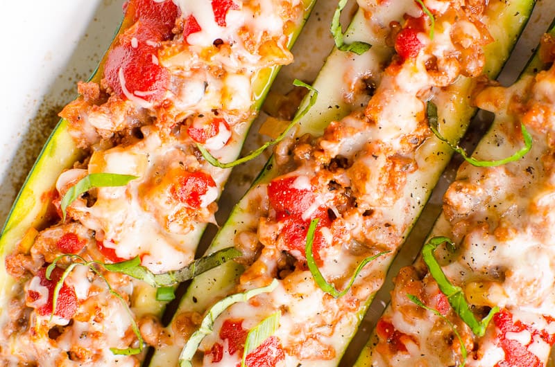 Zucchini boats with ground turkey, tomatoes, basil and cheese.
