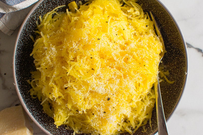 Instant Pot Spaghetti Squash garnished with parmesan cheese and black pepper