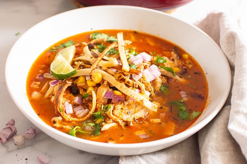 chicken tortilla soup in white bowl