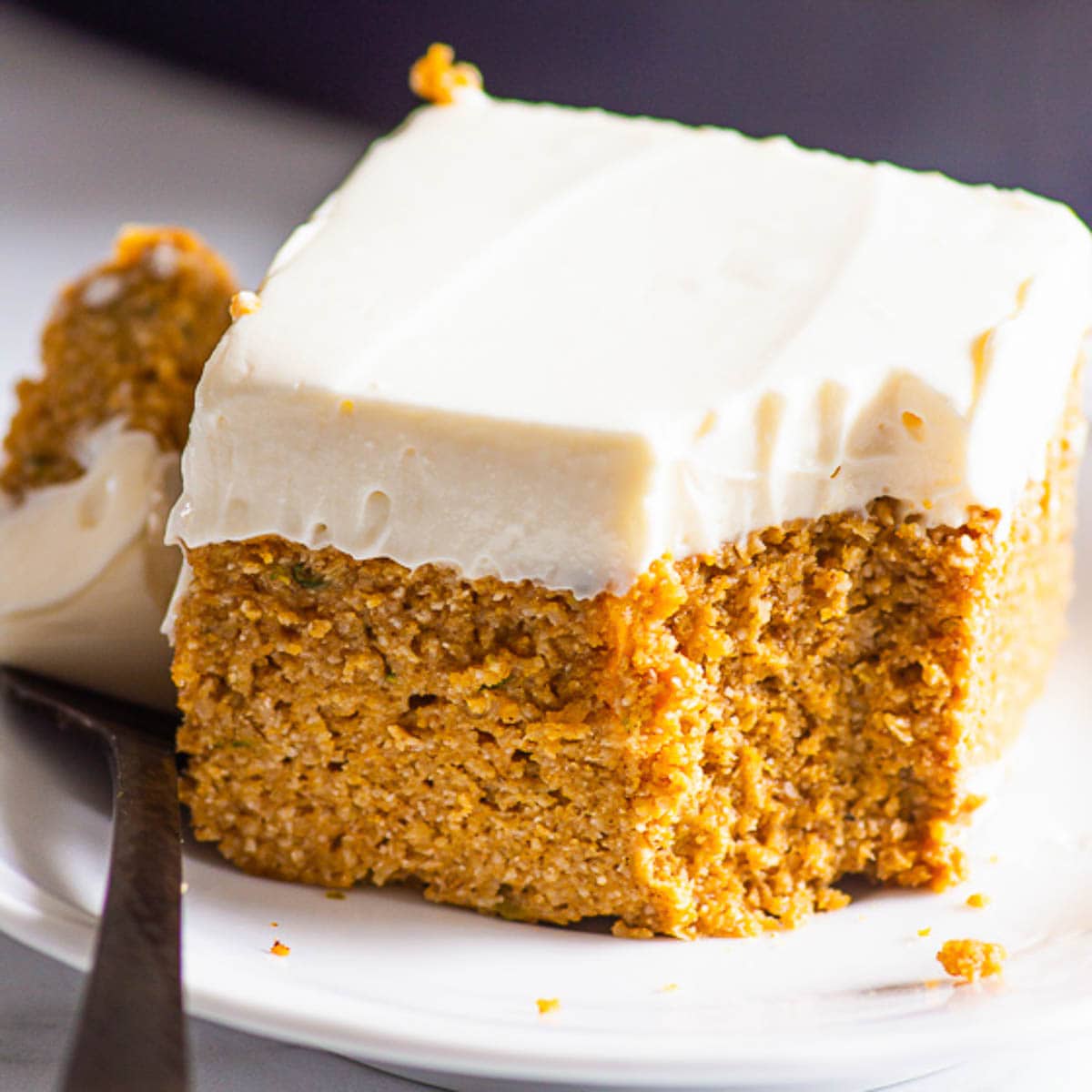 Healthy pumpkin cake on a plate with fork.