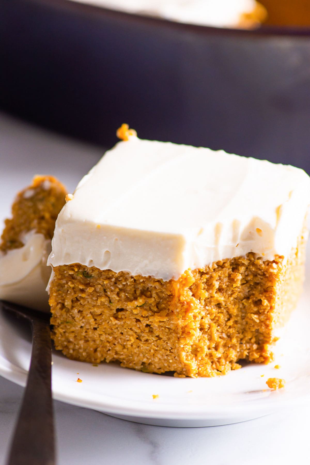 A slice of healthy pumpkin cake on a plate.