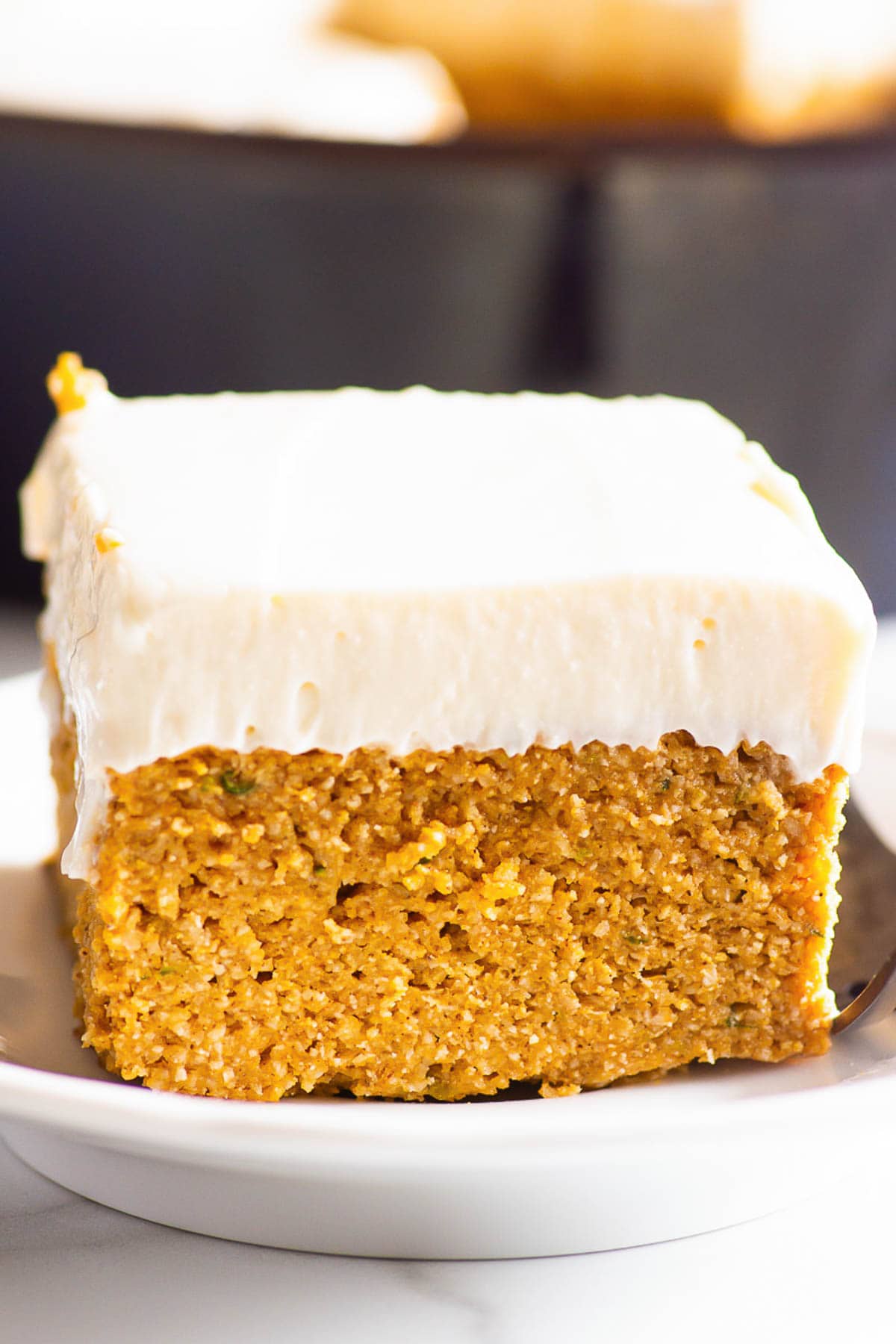 A slice of healthy pumpkin cake on a plate.