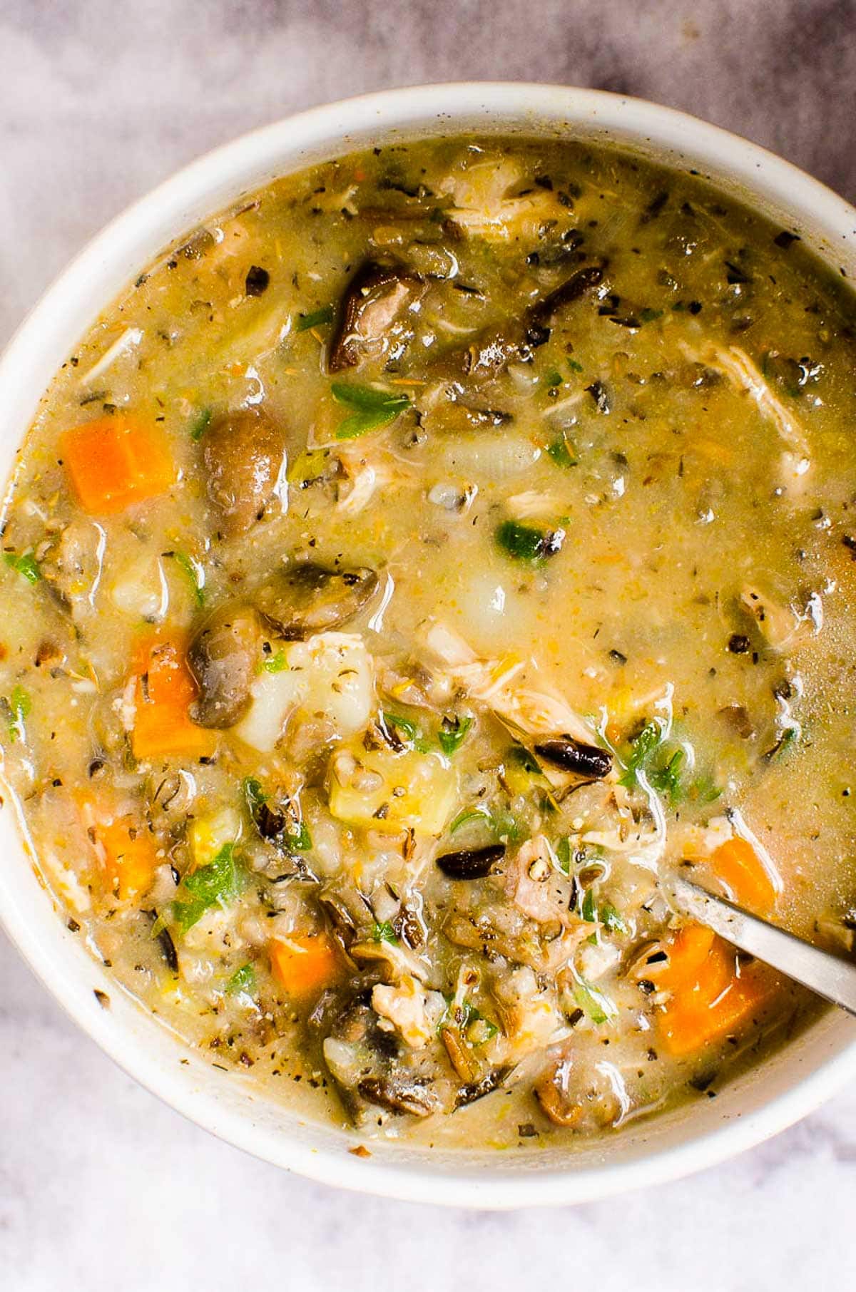 Instant Pot Chicken Wild Rice Soup garnished with parsley