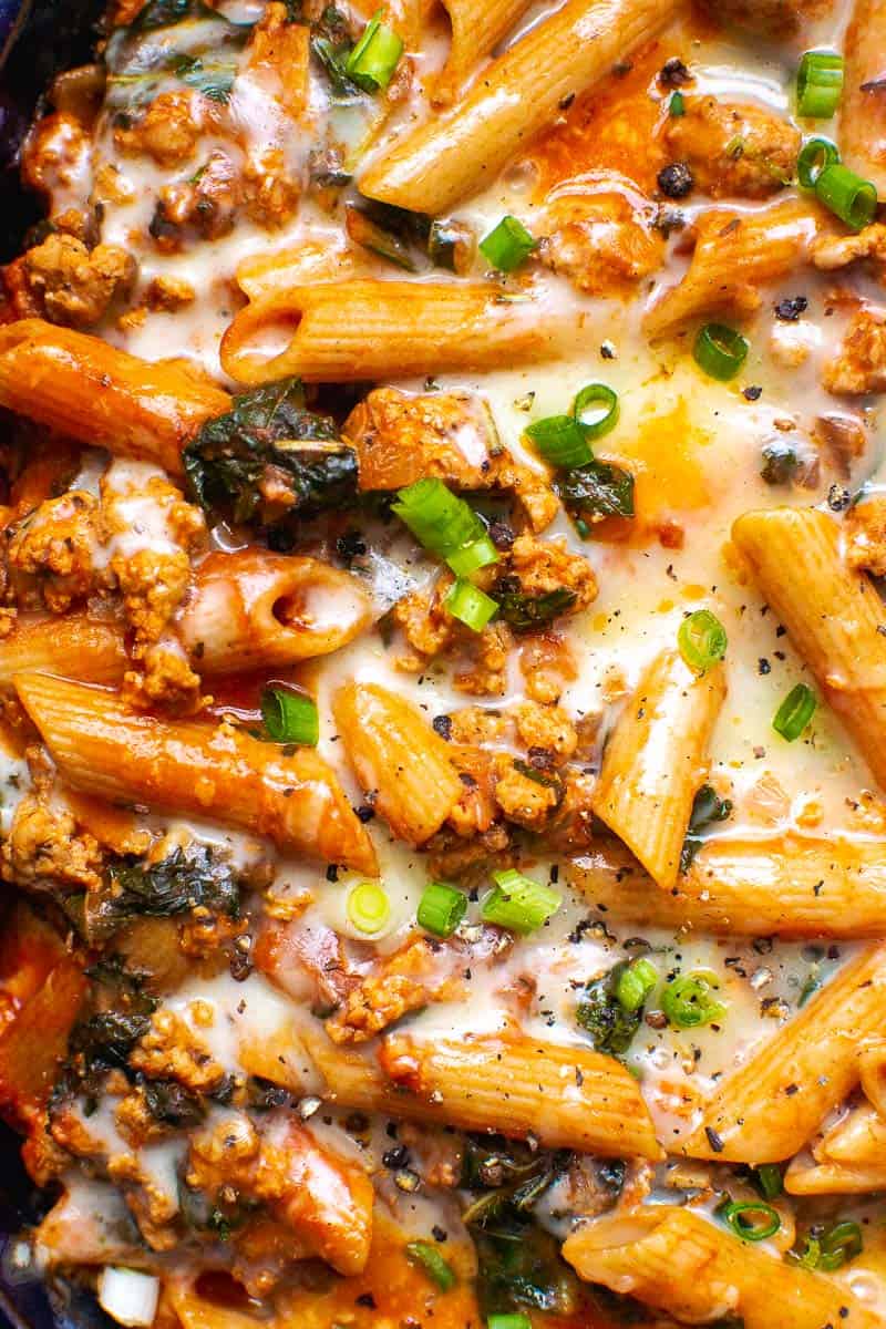 Ground Turkey Meat Pasta Casserole Recipe with melted cheese and green onions