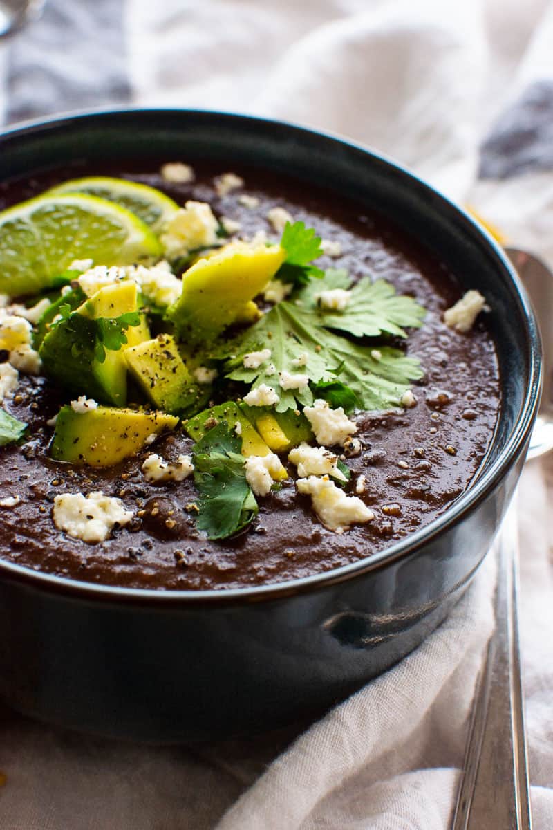 instant pot black bean soup with avocado, lime, cilantro and feta cheese