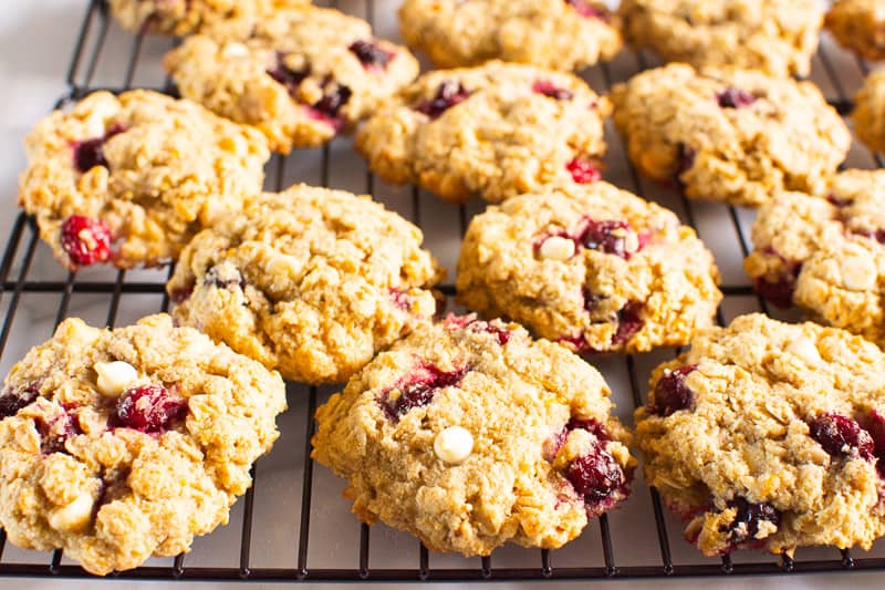 Oatmeal cranberry cookies on a cooling rack.