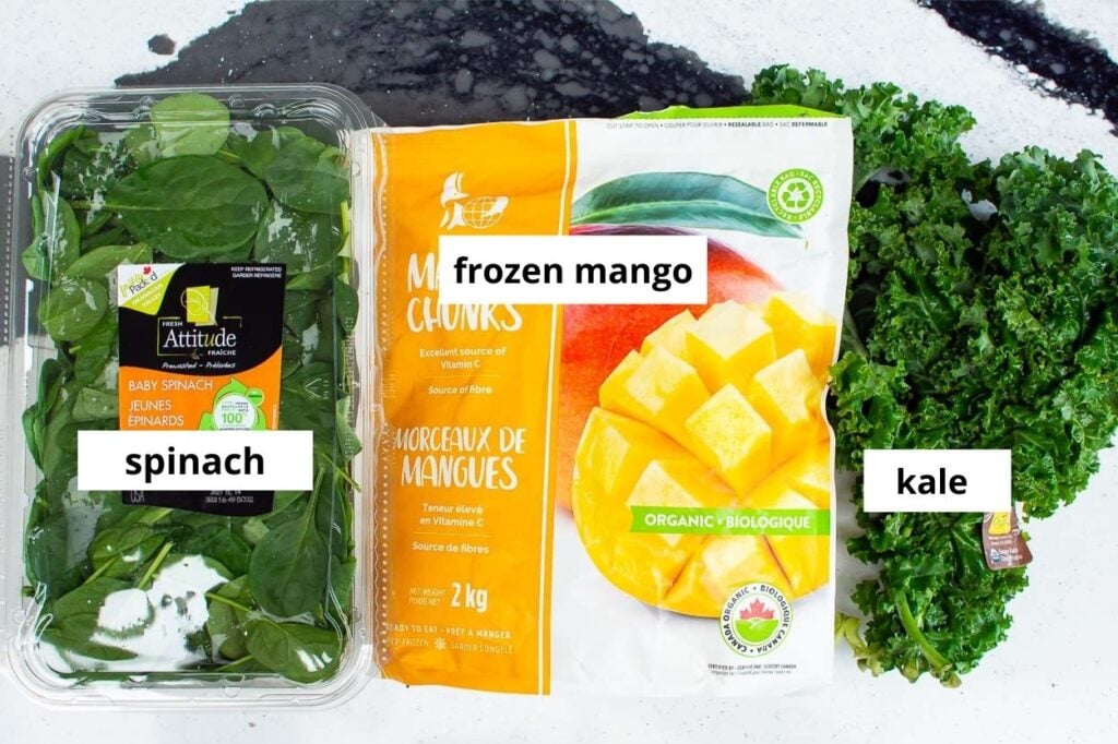 green smoothie ingredients spinach kale and frozen mango