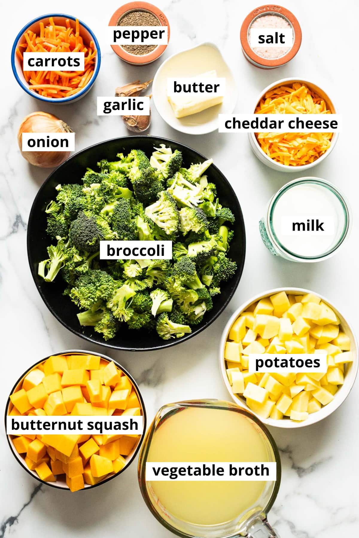 Broccoli, carrots, potatoes, butternut squash, onion, garlic, butter, salt, pepper, cheddar cheese, milk, vegetable broth.