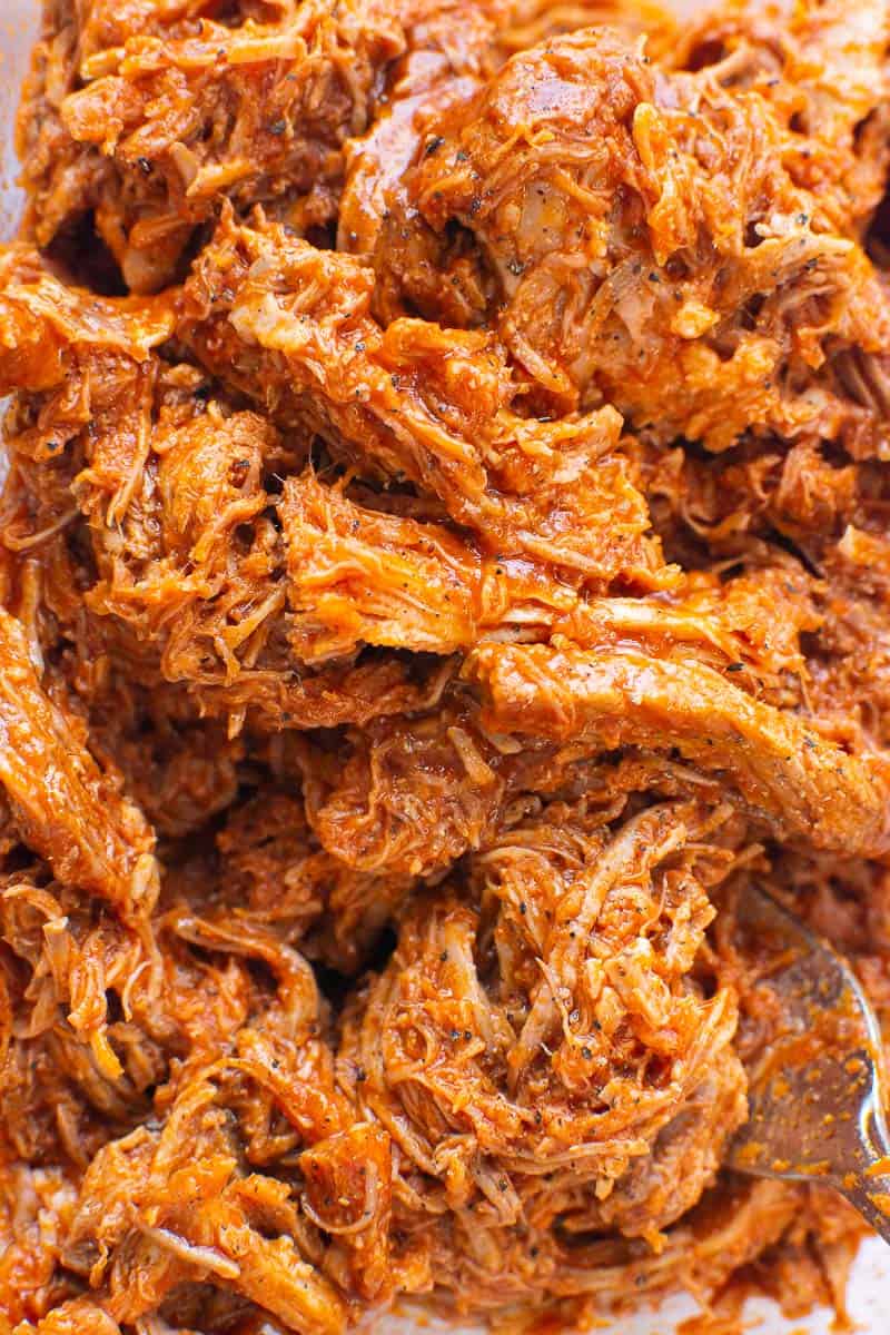 Closeup of shredded Instant Pot pulled pork in BBQ sauce. 