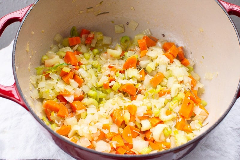 sauteed onion, carrot and celery in red pot