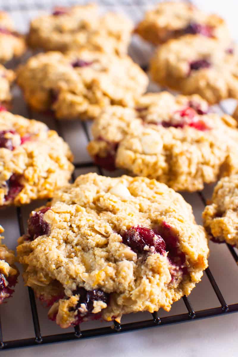 Close up of cranberry oatmeal cookie on a cooling rack.