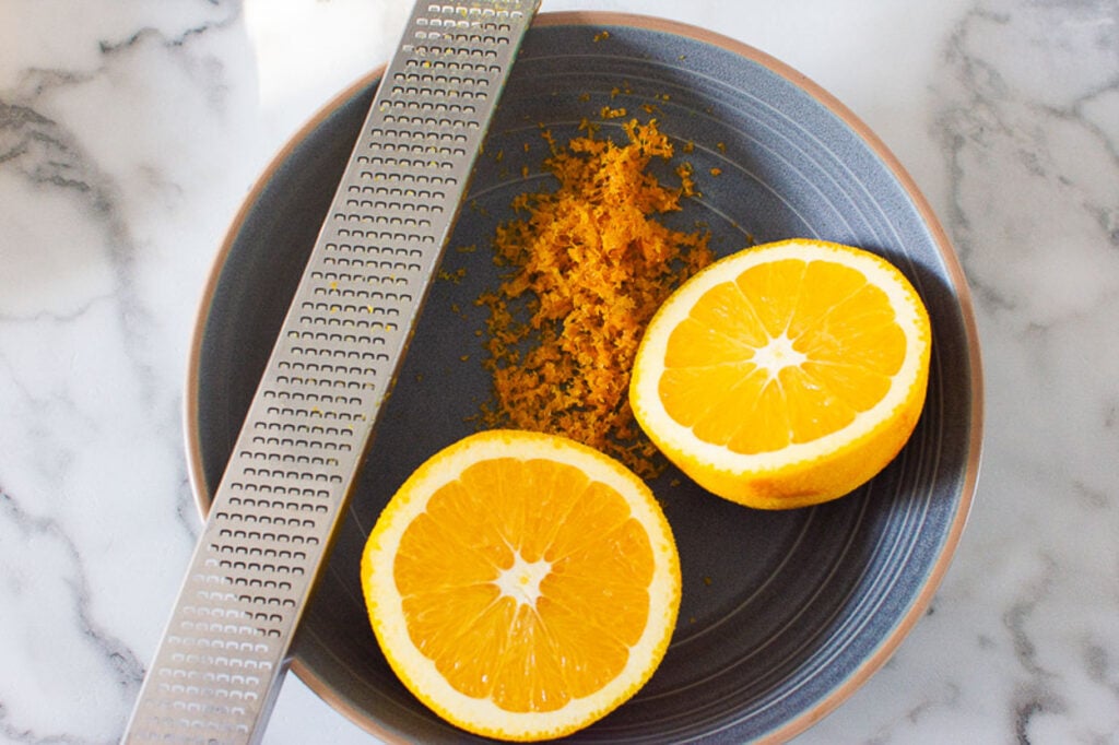 how to zest orange with microplane over a small plate