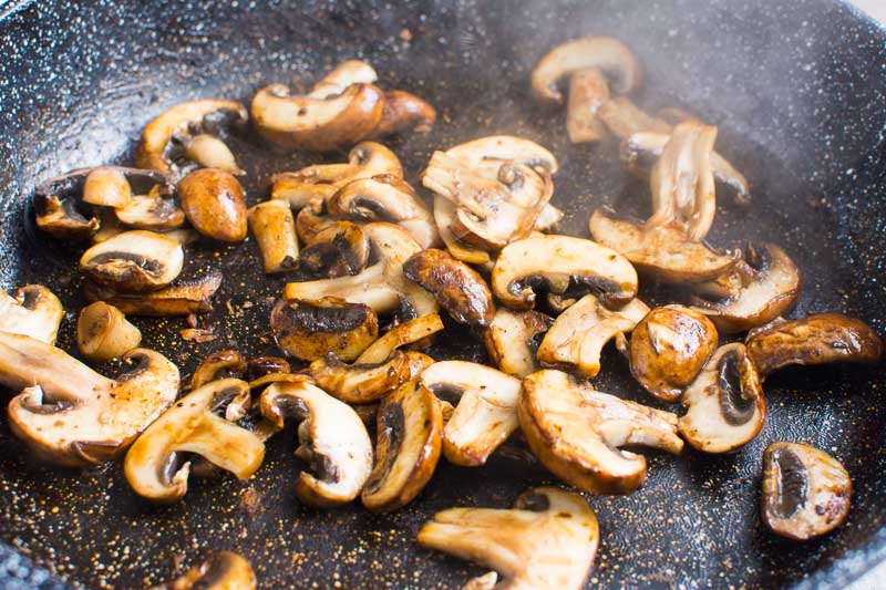 sauteed sliced mushrooms in skillet