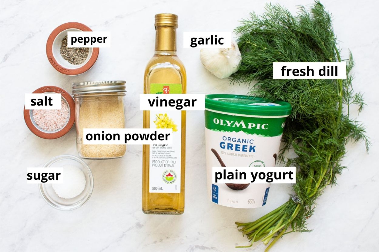 Greek yogurt, dill, onion powder, garlic, vinegar, salt, pepper and sugar.