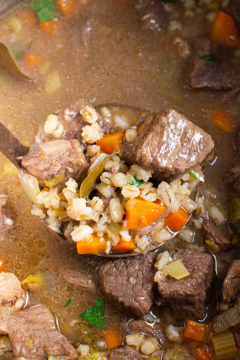 Instant Pot Beef Barley Soup on a ladle