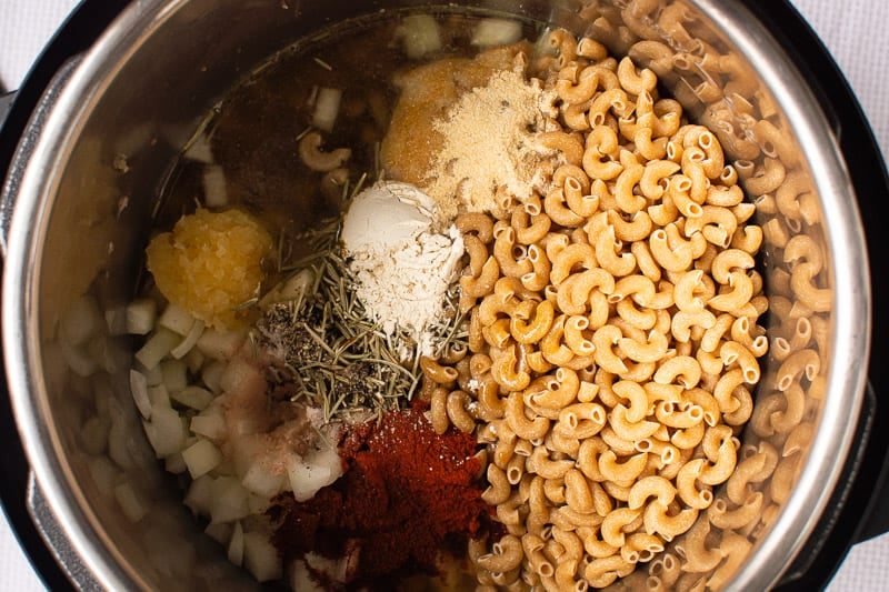 elbow macaroni pasta, onion, garlic, spices, broth in instant pot