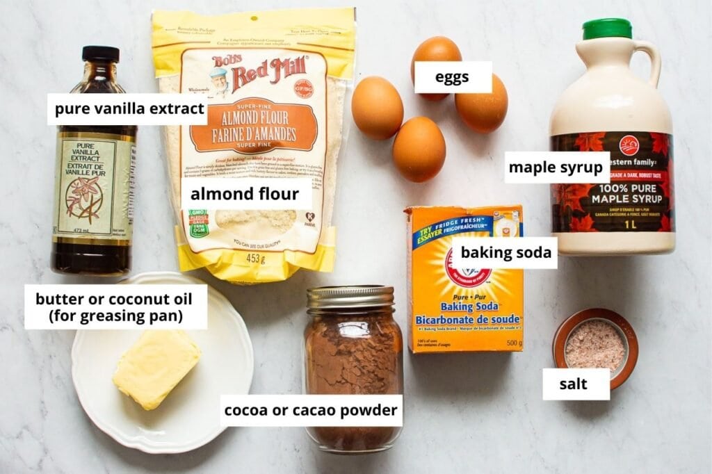 Almond flour, eggs, maple syrup and cacao powder ingredients. 