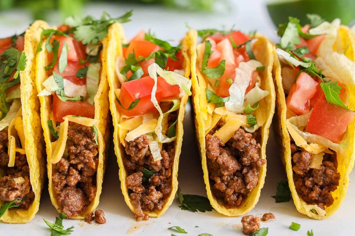 Close up of a row of Ground Beef Tacos.