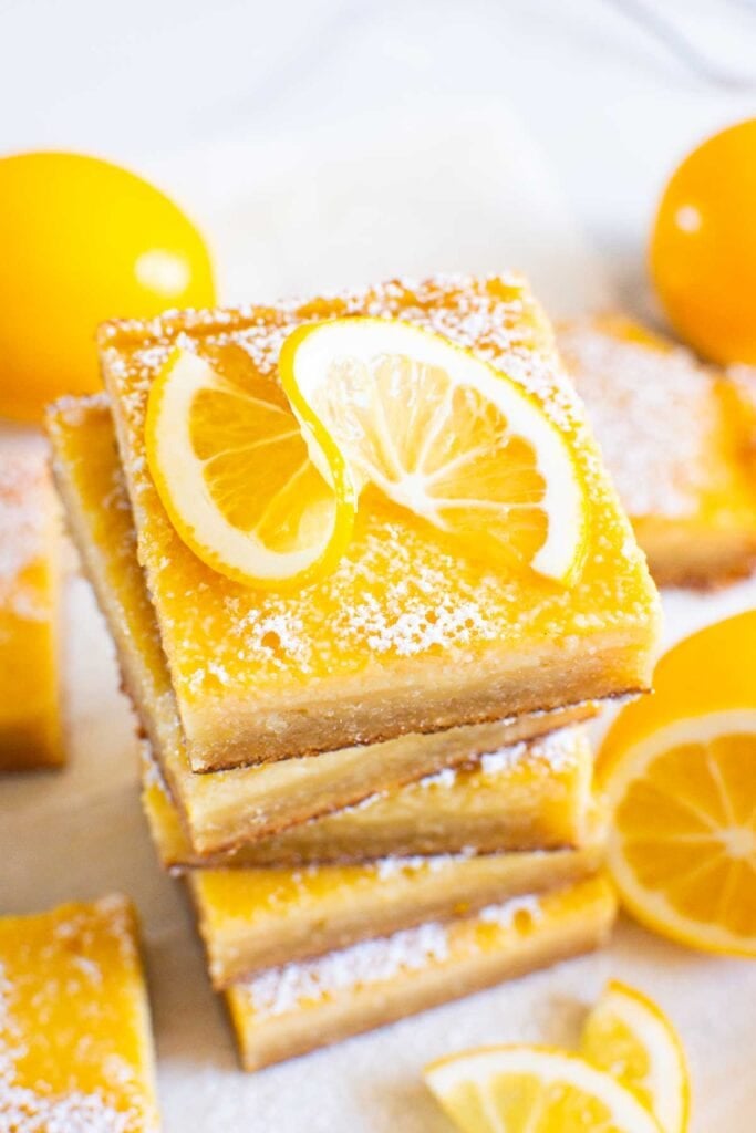 gluten free lemon bars stack garnished with lemon slice