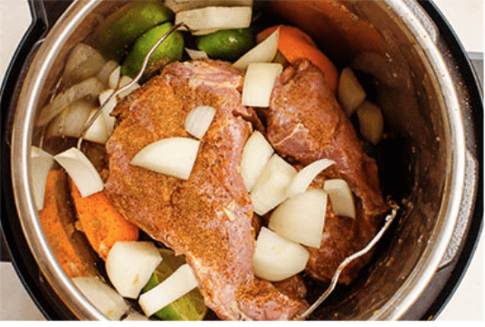 seasoned pork shoulder, onion, citrus in pressure cooker