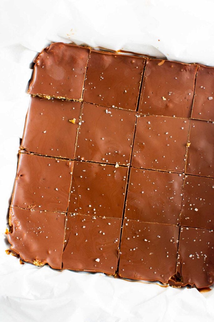 cut up peanut butter bars in a baking tray