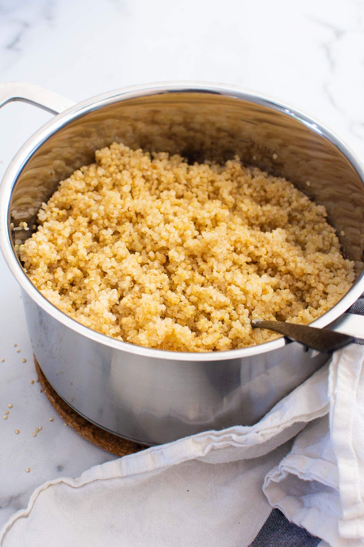 Cooked quinoa in a stove pot.