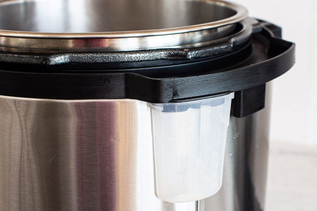 instant pot with steam collector cup attached
