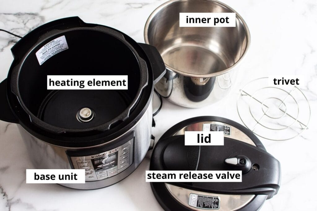instant pot base, pot, lid and trivet on a counter
