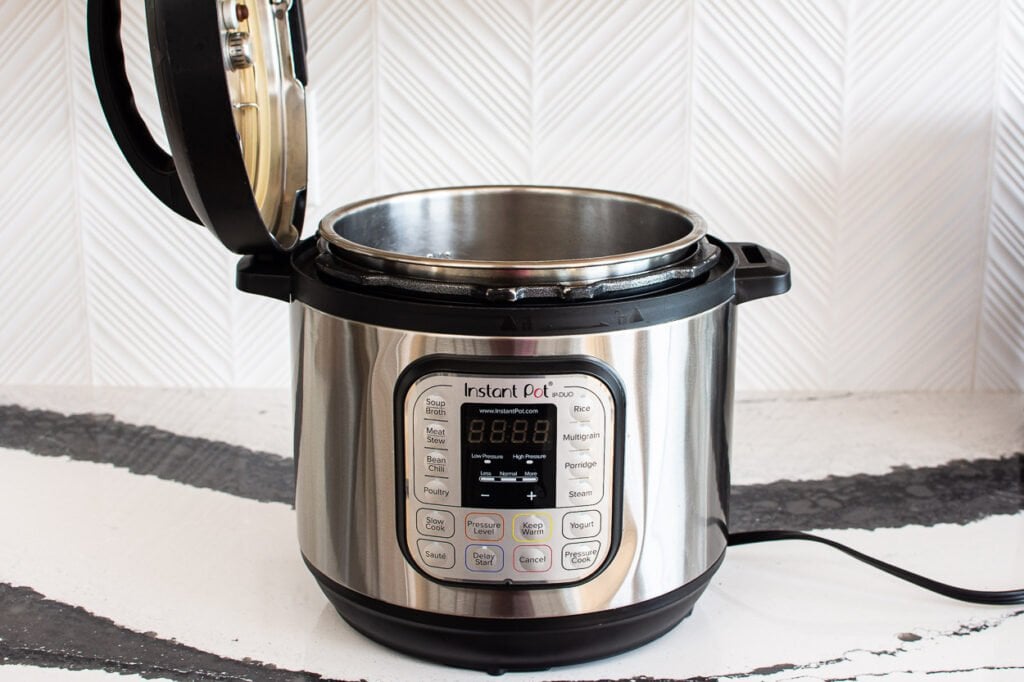 instant pot with lid in a lid holder