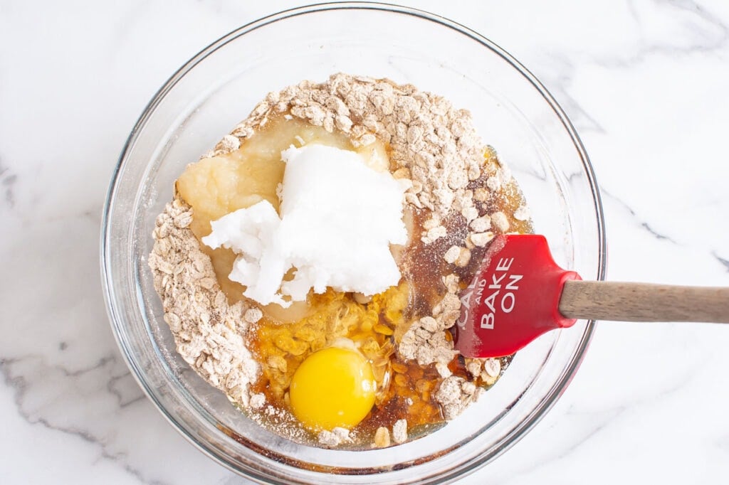 applesauce, oats, egg and coconut oil in bowl.