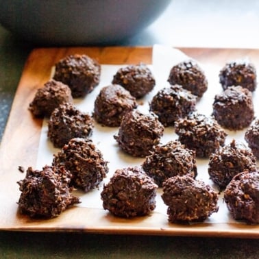 Healthy chocolate coconut balls on tray.